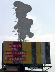 Héctor de Anda Esto es una obra de arte/  instalación Anuncio espectacular intervenido / tintas serigráficas y vinyl sobre láminas de metal 17 láminas ensambladas  hacen un total  de 1150cm x 900cm 2003 
